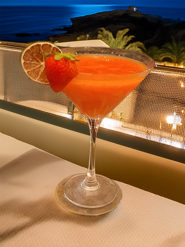 A pale yellow Daiquiri cocktail served in a coupe glass with a lime wheel garnish.